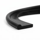 Black rubber extrusion curved into a loop, close-up studio shot