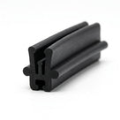 Black rubber T section extrusion with side slot channels, angled studio shot