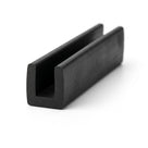 Black EPDM U-channel profile standing upright, plain white background shot of square-ended block