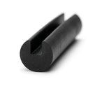 Black EPDM edge trim profile coiled, close-up end-on view of rounded groove
