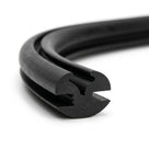 Coiled length of black rubber weatherstrip showing twin-bulb glazing channel
