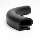 Curved length of black rubber hollow D-section with slotted flange