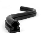 Coiled black rubber seal with mushroom-shaped hollow profile on white background