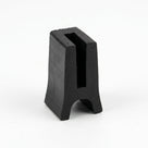Black solid neoprene H-section standing upright, showing the slotted panel channel and rounded foot