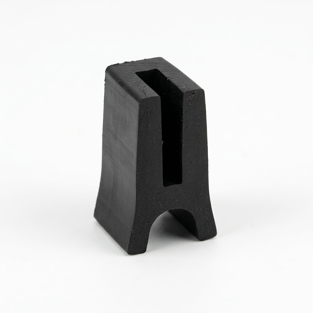 Black solid neoprene H-section standing upright, showing the slotted panel channel and rounded foot