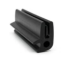 Black rubber boot seal cut length photographed at an angle, hollow bulb profile visible