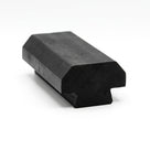 Short black rubber block section with slotted foot, angled studio shot