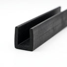 Black EPDM U-channel trim profile coiled, angled shot of square-ended groove