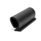Black rubber door seal with hollow bulb and flat fixing foot, studio shot
