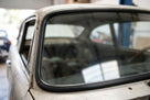 Windscreen seal fitted to the rear window of a silver classic Jaguar saloon