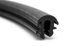 Black rubber windscreen seal with locking channel, coiled length on white background