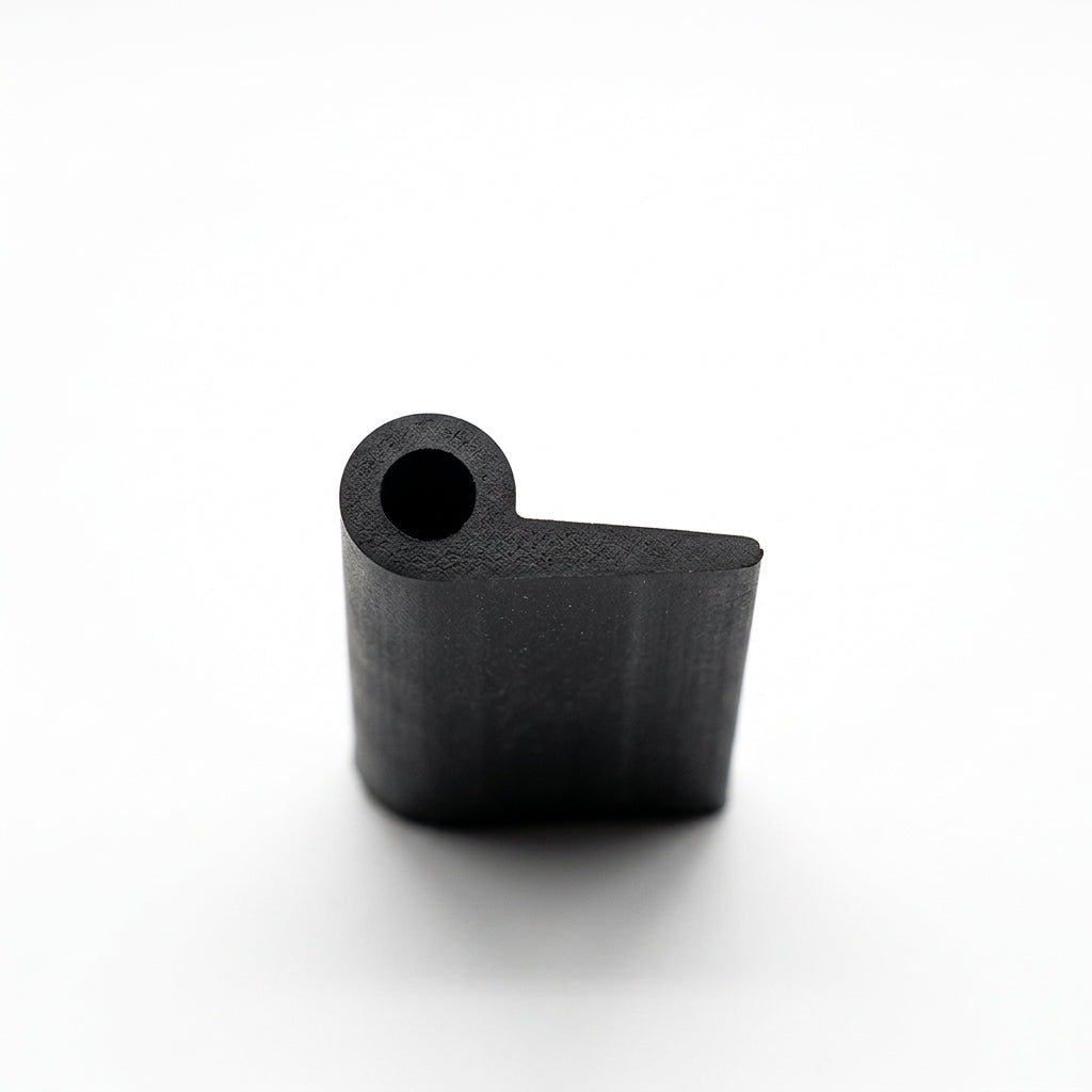 Black hollow piping shown end-on, revealing its round bead and flat tail profile