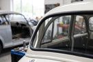 Windscreen seal fitted to the corner of an ivory classic car's rear window