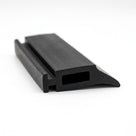 Black solid neoprene T-section with a hooked mounting foot and hollow slot, angled studio shot