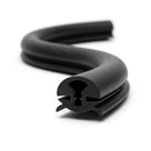 Black EPDM weatherstrip coiled, showing a keyhole-shaped locking channel profile