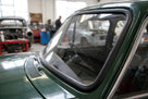 Black rubber windscreen seal cut length photographed at an angle