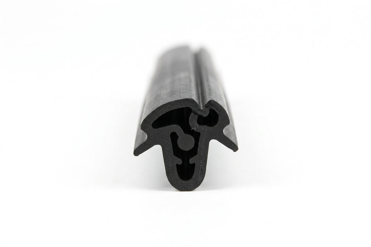Black rubber windscreen seal shown end-on with internal locking channel, studio shot