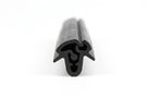 Black rubber windscreen seal shown end-on with internal locking channel, studio shot