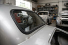 Windscreen seal fitted to the rear window corner of a silver Jaguar XK120