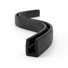 Black EPDM U-channel edge trim shown as coiled S-curved length with side ridge detail