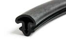 Black rubber windscreen seal with mushroom-shaped hollow bulb, curved length on white background