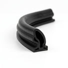 Length of black rubber seal coiled to show bulb profile and fir-tree fixing leg