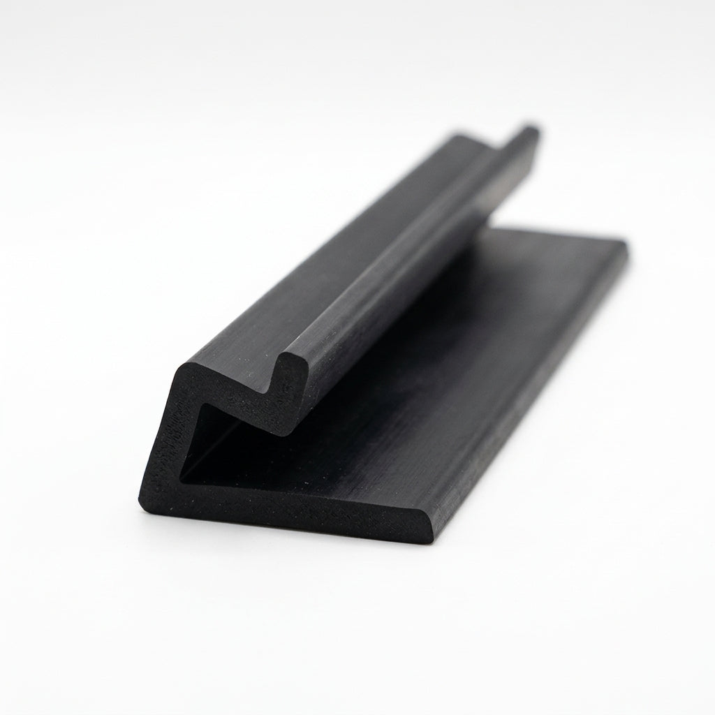 Black rubber door seal with hooked lip and flat flange, angled studio shot