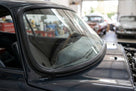 Windscreen seal fitted to the frame of a dark classic Jaguar E-Type