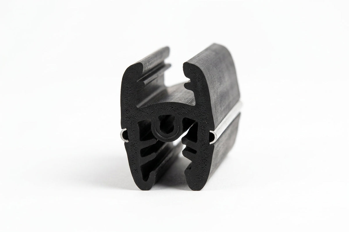 Black rubber windscreen surround seal shown end-on, revealing the hollow twin-lobe cross-section and gripping fins