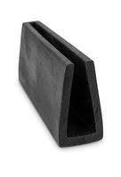 Black EPDM U-channel profile standing at an angle, plain white background shot of square block