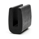 Black neoprene U-channel profile standing upright, plain white background shot of rounded block