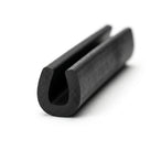 Black EPDM round U-channel profile coiled, close-up end-on view of U-shaped groove