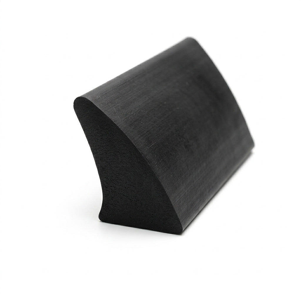 Black rubber shark fin section viewed end-on, curved dome tapering to one point