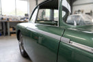 Herzim strip fitted as a silver trim insert along a green classic car's waistline
