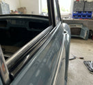 Herzim strip fitted as gloss black trim along a classic car's window surround