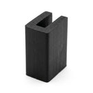Black EPDM U-channel profile standing upright, plain white background shot of square-ended block