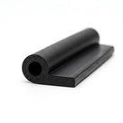 Black hollow P section rubber profile, angled close-up studio shot