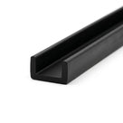 Black rubber U-channel profile coiled, angled view of wide square-ended groove