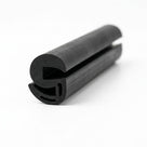 Black S-shaped window rubber seal shown as coiled length with bulb and open channel