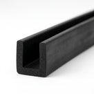 Black rubber square U-channel profile coiled, angled view of square-ended groove