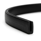 Black PVC edge trim shown coiled into a loop on a white background