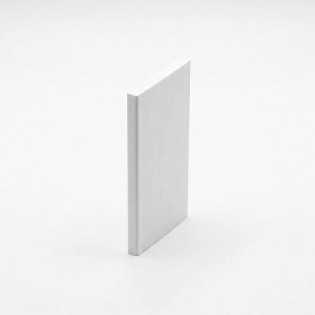 White PVC flat panel insert standing upright, viewed at an angle on white background