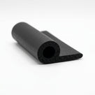 Black sponge rubber hollow section with round bead and flat tail, studio shot