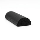Black half-round sponge rubber strip on white background, cut end showing porous texture