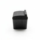 Black expanded EPDM sponge strip, end-on studio shot showing the lipped profile