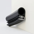 Rendered side seal fitted to a panel edge corner, showing hollow bulb and trailing solid rubber tail