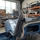 Self grip door seal fitted to the windscreen pillar of a blue Triumph TR7