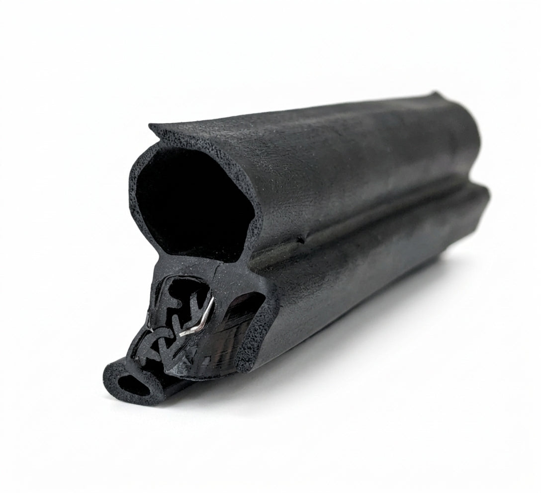 End-on view of black rubber seal showing hollow bulb and metal grip teeth