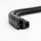 Self grip side seal bent into a right-angle corner, showing toothed grip and round sponge bulb