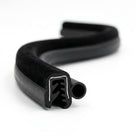 S-coiled side seal with a flocked velvet-textured edge and hollow tube-shaped sponge bulb